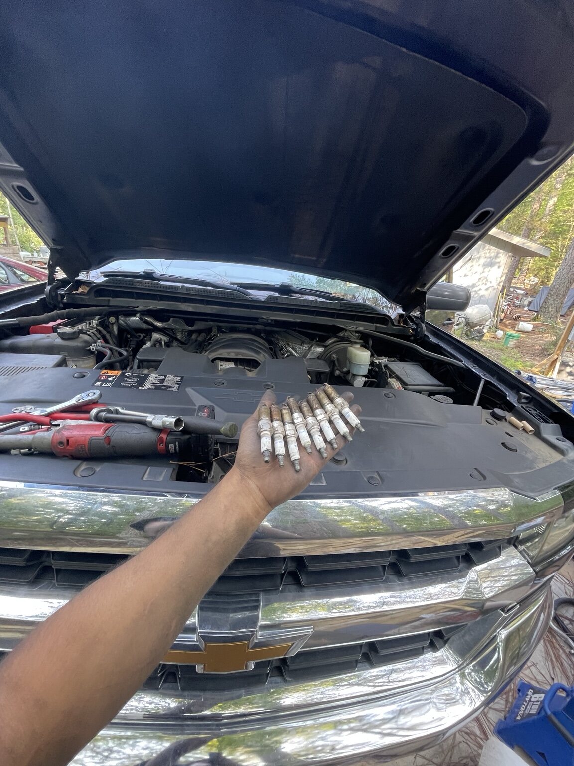 Spark plug service on a Chevrolet truck