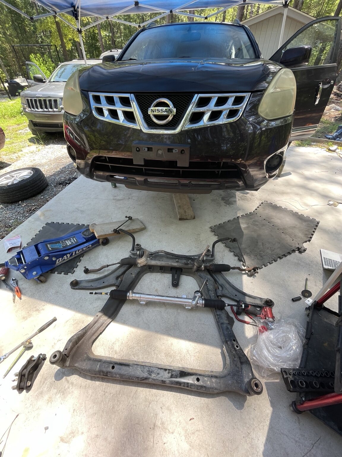 Steering rack and subframe repair on a Nissan